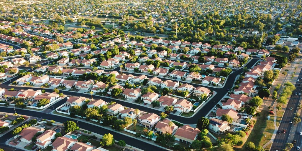 Aerial view of a suburban residential neighborhood; representative housing image, not an ARMLS listing