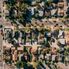 Illustrative aerial view of residential neighborhood for California housing market report