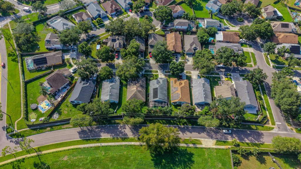 Aerial view of a residential neighborhood with houses and trees, illustrating the mortgage portfolio