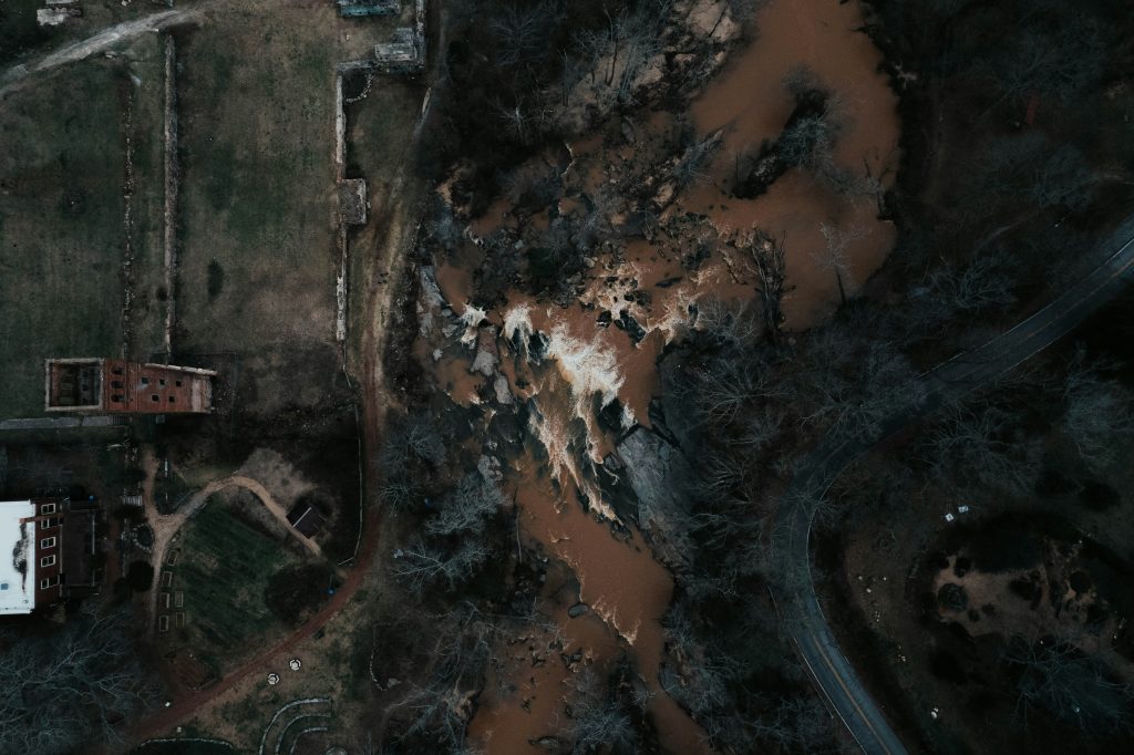 Aerial view of a residential property among trees; illustrative image, not the October 2026 Allendale tornado