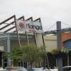 Retail shopping center exterior and parking area, illustrating shopping-center leasing