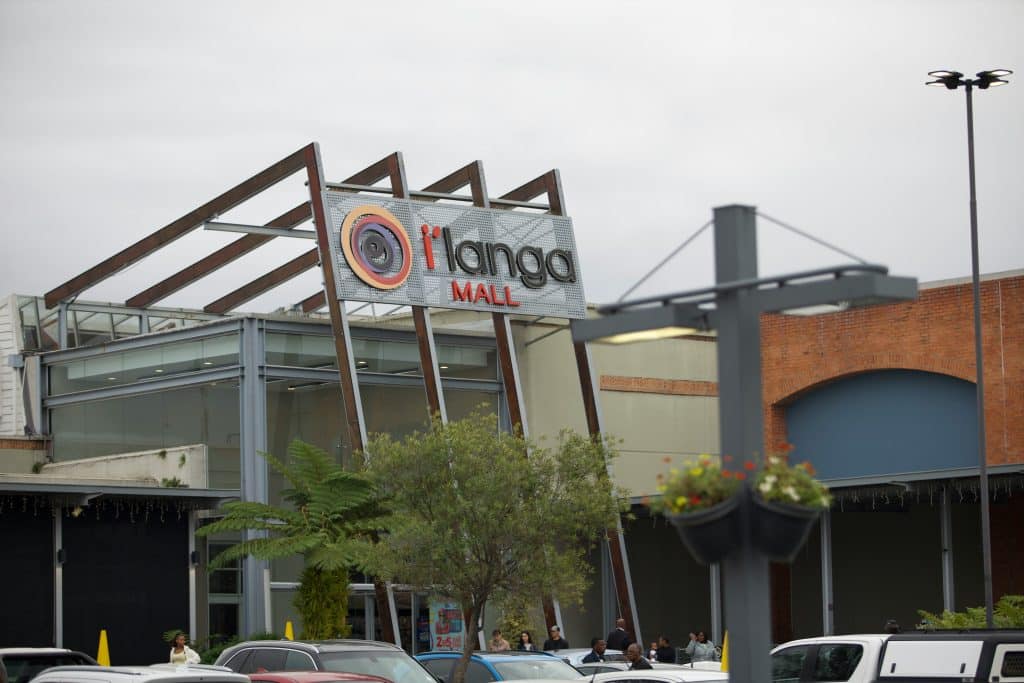 Retail shopping center exterior and parking area, illustrating shopping-center leasing