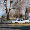 Small home in a rural landscape illustrating affordable housing and small mortgage lending