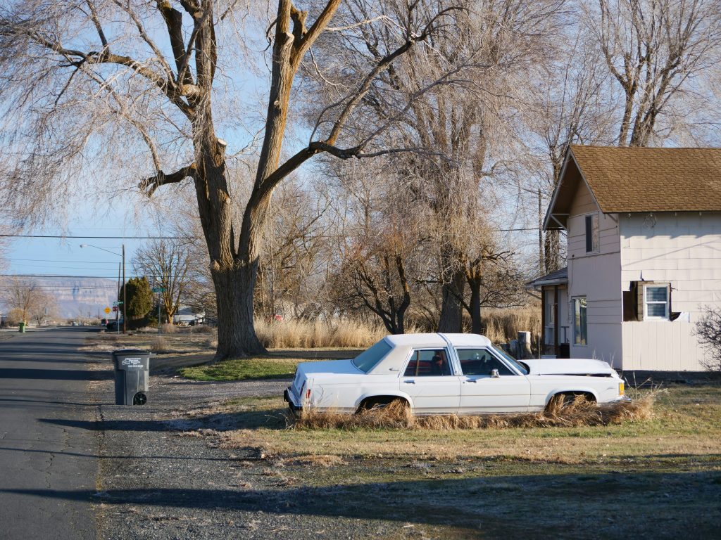Small home in a rural landscape illustrating affordable housing and small mortgage lending