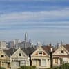 Victorian Painted Ladies homes in San Francisco with skyline in the background; illustrative image