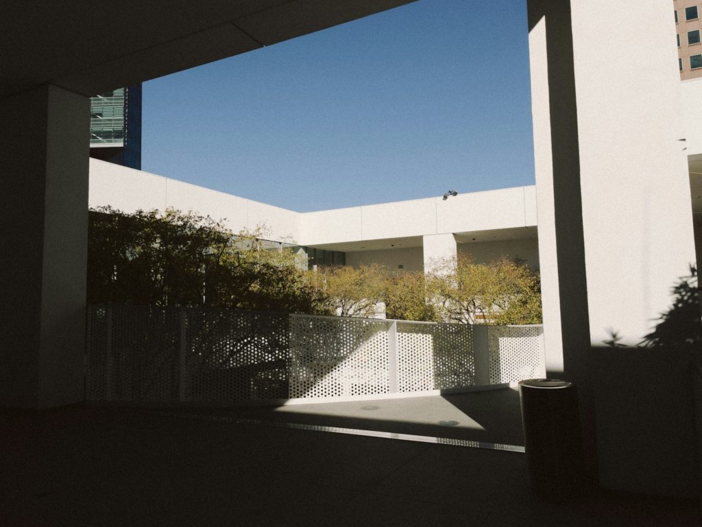 Apartment exterior illustrating six-property California refinance; not an identified portfolio building