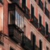Residential-style building facade and balconies in Madrid, Spain, illustrative of Spain housing policy