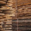 Stacked wood lumber illustrating forest products and the building materials market