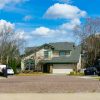 Residential neighborhood street illustrating national housing inventory and pending sales; not a specific property in the market data