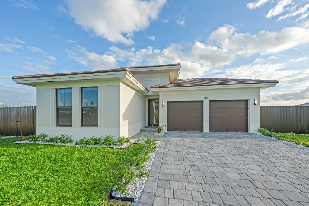 Single-family home exterior with driveway, illustrating mortgage originations; not a specific PenFed-financed property