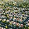 Aerial view of a suburban neighborhood of single-family homes, illustrative image for institutional investor housing regulation