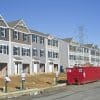 Row of townhouses under construction, illustrating the new-home market ahead of October 2026 economic releases