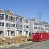 Townhouses under construction; illustrative photograph, not the Lennar Fort Monmouth development